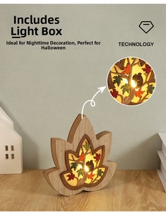 Close-up of maple leaf wooden light box with squirrel carving and warm LED lights