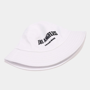 Close-up of Los Angeles vintage embroidery on white cotton canvas bucket hat with stitching