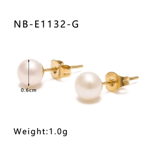 Detail of 0.6cm pearl earrings with gold studs, weighing 1.0g on white background