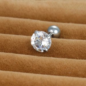 Detailed close-up of a silver titanium steel stud earring with a clear cubic zirconia stone