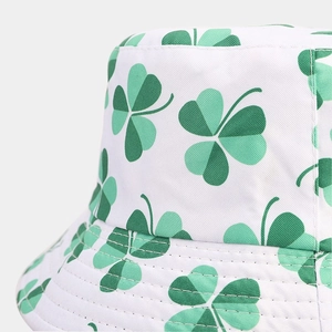 White bucket hat with green clover print made of high-quality cotton canvas material