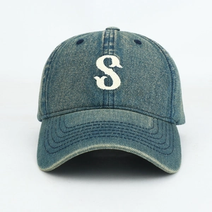 Close-up of vintage washed denim baseball cap featuring white embroidered letter S