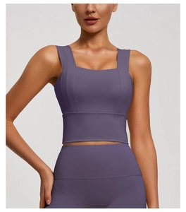 Detail view of purple wide-strap sports bra and high-waisted yoga leggings set