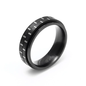 Black 6mm rotatable spinner ring made of matte stainless steel with silver grid texture