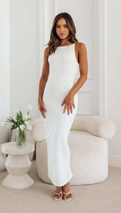 Detail of white backless maxi dress showing unique 3D wave texture fabric and slim fit design