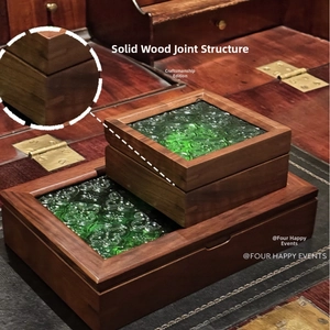 Detail of walnut wood jewelry box with dovetail joints and vintage green textured glass
