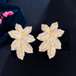 Close-up of leaf-shaped earrings with micro-paved sparkling cubic zirconia stones