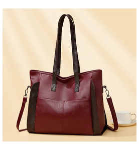 Detail of the soft PU leather texture and sturdy metal ring buckles on this tote bag