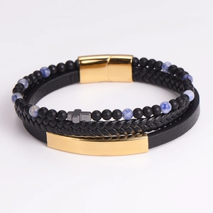 Detail of multi-layer leather bracelet with blue beads, cross charm and gold magnetic clasp