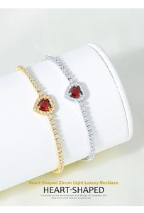 Macro shot of gold and silver heart zircon bracelets on a white jewelry display stand