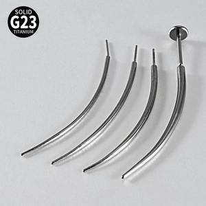 Detailed view of silver G23 titanium curved insertion tapers for body piercing jewelry