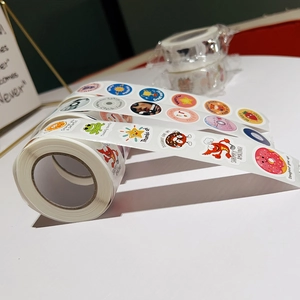 Detailed view of colorful cartoon reward stickers with puns on a white background