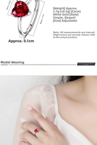 Detailed dimensions and fit of heart-shaped red zircon ring with adjustable band on hand