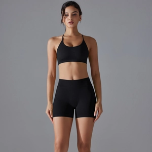 Front view of black ribbed seamless yoga set featuring a sports bra and high-waisted shorts