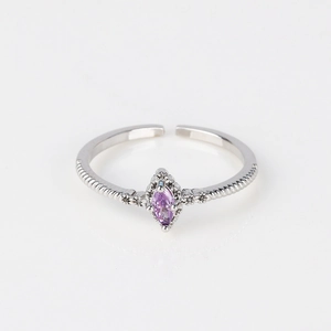 Detail of adjustable silver ring with marquise-cut purple zircon and pavé setting