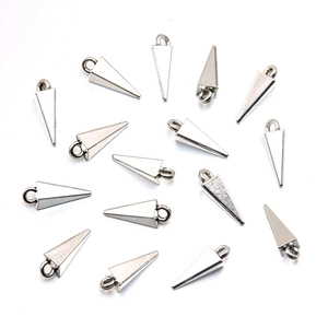 Detailed view of silver cone-shaped metal charms with loops for DIY jewelry making