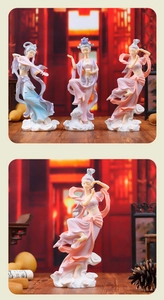 Close-up of three colorful Dunhuang flying celestial maiden resin figurines on cloud bases