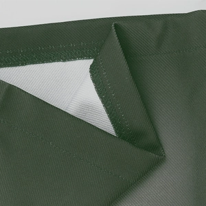 Close-up detail of dark green twill fabric showing fine stitching and textile texture