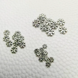 Silver flower spacer beads in various sizes for DIY jewelry and bracelet making