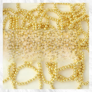 Detail shot of multi-layer 18K gold plated beaded stretch bracelets with metallic luster