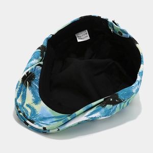 Inside view of tropical coconut palm print ivy cap showing black lining and 100% cotton label