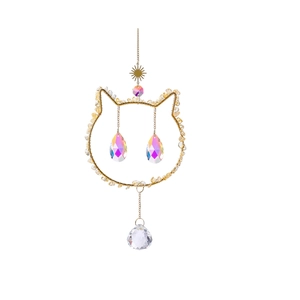 Detail of a golden cat-shaped suncatcher featuring yellow crystal stones and prisms