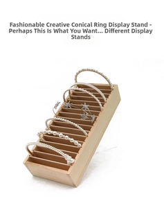 Macro view of multi-slot wooden jewelry display stand holding pearl headbands