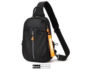 Detail view of black waterproof nylon sling bag featuring orange fashion tag and mesh back