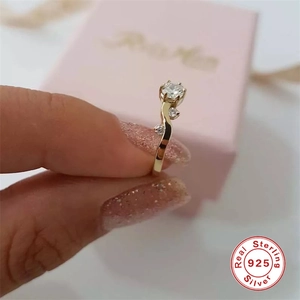 Close-up of S925 sterling silver gold plated ring with luxury stones and 925 seal
