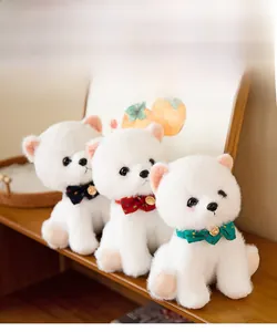 Detailed view of three white plush Pomeranian dogs with colorful polka dot bow ties
