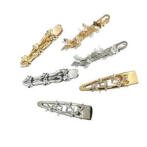 6-piece set of gold and silver butterfly hair clips with crystals on a white background