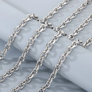 Detailed view of silver stainless steel O-chain wallet link on a minimalist stone pillar