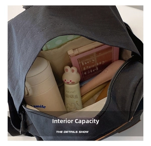 Close-up of the black canvas backpack interior showing the spacious main compartment