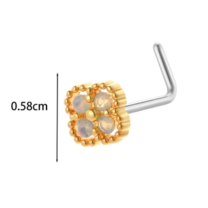 Detail view of L-shaped titanium nose stud with 0.58cm square gold frame and opal stones