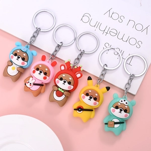 Five cute Shiba Inu cartoon keychains in assorted colors with metal rings for bags