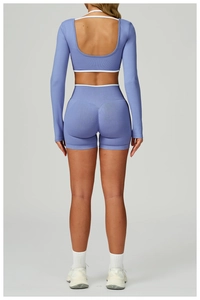 Detail of lilac rib-knit yoga set featuring an open back long sleeve top and high waist shorts