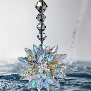 Star-shaped rainbow crystal suncatcher with faceted beads reflecting light in water