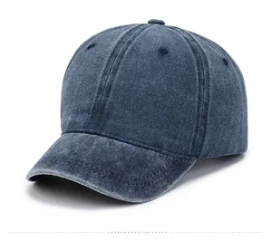 Close-up of vintage washed blue denim baseball cap with retro short brim and six-panel crown