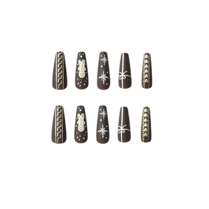 Christmas gingerbread man and snowflake press-on nails in long coffin shape