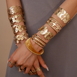 Golden flower and ginkgo leaf open bracelets set with minimalist rings for women