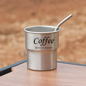 304 stainless steel coffee mug with step design, metal straw, and outdoor wood setting