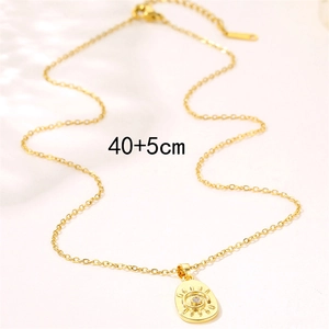 18K gold geometric sun and evil eye pendant necklace with crystals on white surface