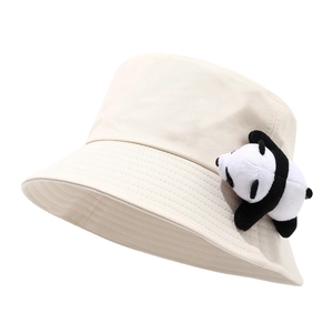 Minimalist beige cotton bucket hat featuring a cute small panda plush doll on the side