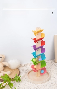 Detail of colorful wooden music tree toy leaves with marble track for kids learning