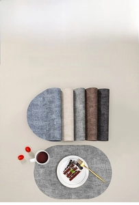 Texture detail of heat-resistant oval PU leather placemats in Morandi color tones