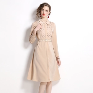 Elegant apricot long-sleeve shirt dress with high waist belt and textured chest detail