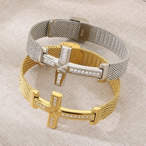 Detailed macro of gold and silver stainless steel mesh bracelets with diamond crosses