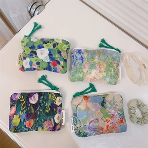 Detailed set of four oil painting style cotton pouches with artistic floral patterns
