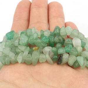 Macro shot of natural green agate tumbled stones for DIY jewelry making and necklaces