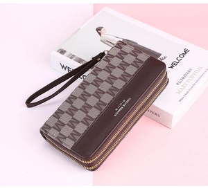 Detail of vintage double-zipper long wallet with monogram pattern and wrist strap